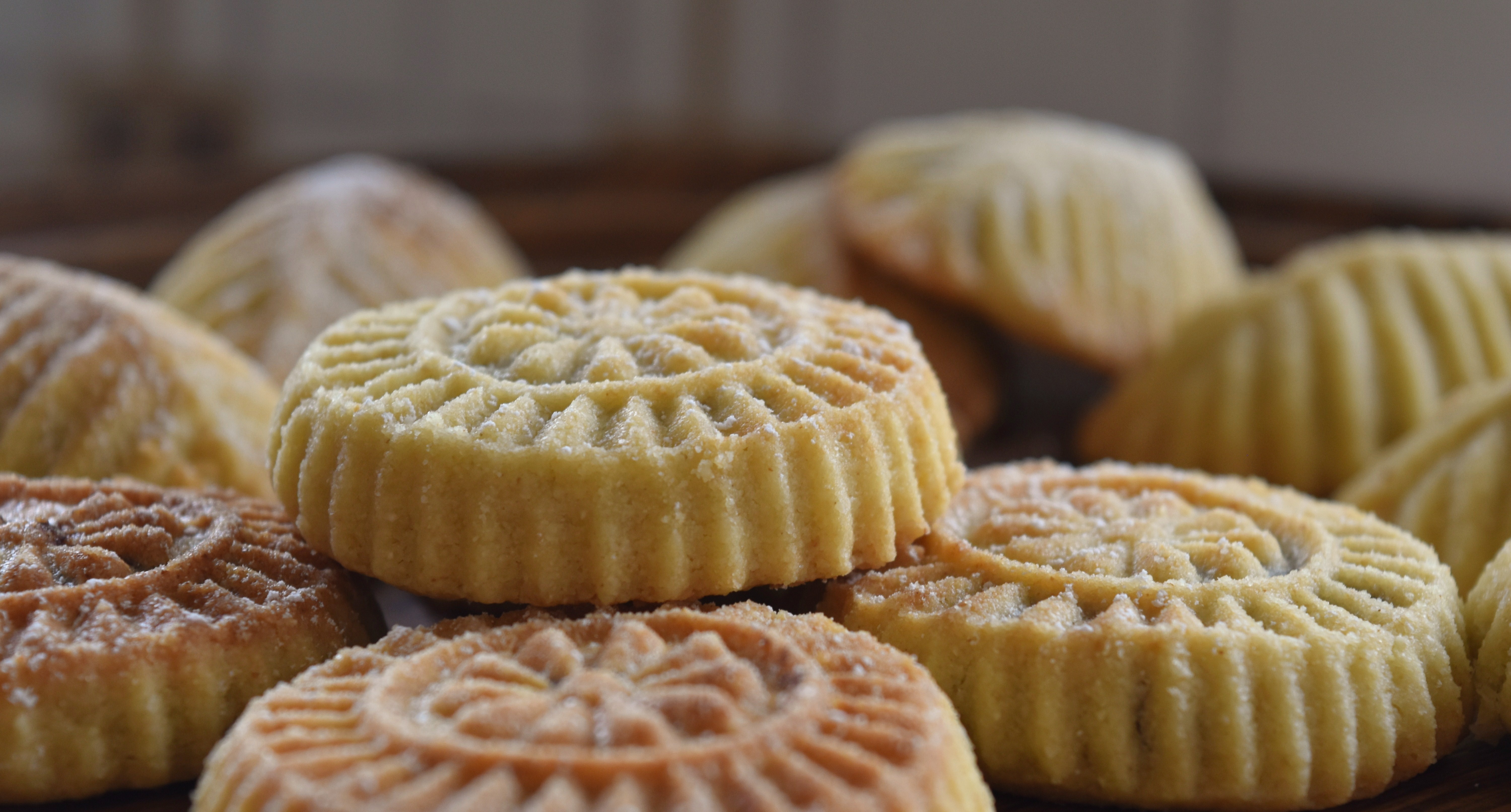 Close-up of Ma'amoul, a traditional sweet Arabic pastry prepared for Eid, showing intricate patterns and golden-baked texture